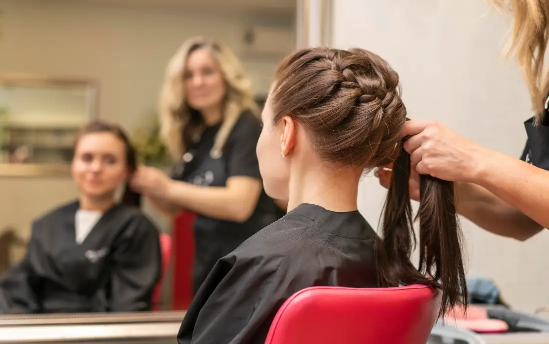 Professional hairstylist working in a best hair salon in Kochi